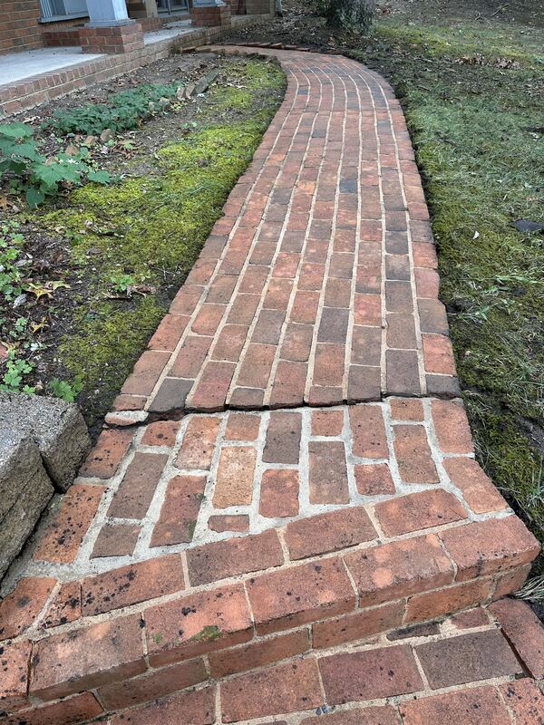 Restored brick walkway after pressure washing